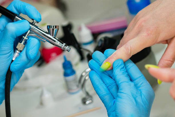 Press down on the trigger to release the paint