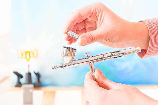 Dump out any paint that is inside the airbrush gun